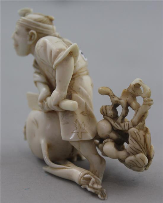 A Japanese ivory okimono of a farmer cutting a large turnip, signed Gyokushi, late 19th / early 20th century, 7cm, slight restorations